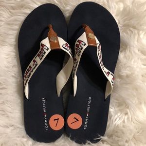 Tommy Hilfiger flip flops size 7.